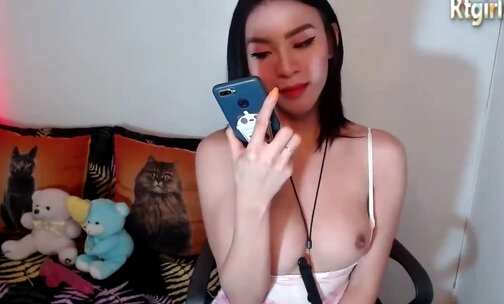 slim ladyboy with big boobs and tattoos masturbates on webcam
