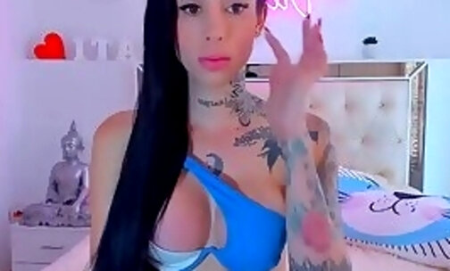 Tattooed tranny with big boobs