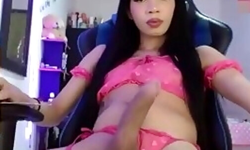 slim teen shemale cutie with tattoos wanks off her huge dick on webcam