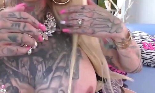 Big tits tgirl covered in tattoos