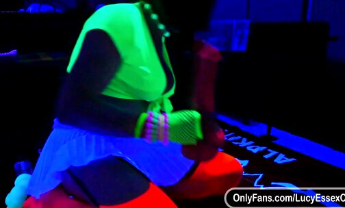 Lucy Essex CD riding a huge horse dildo in glow in the dark chastity cage