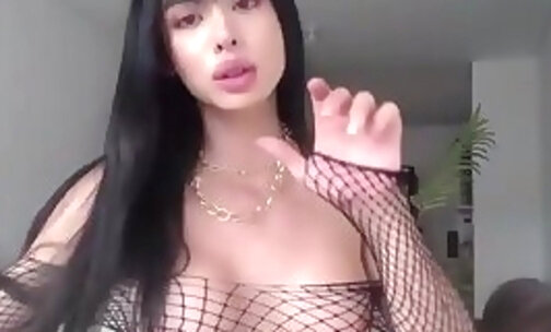 pretty tgirl in sexy fishnet lingerie teases on webcam