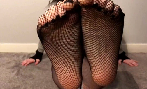 Fishnets pantyhose feet and legs teasing.