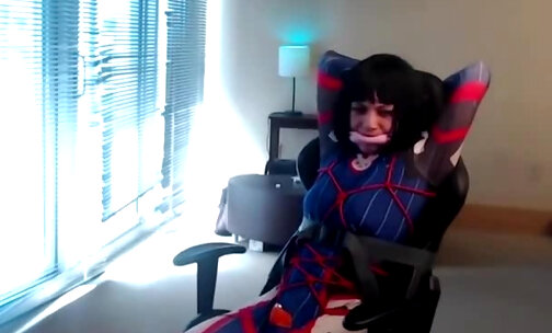 Crossdresser in D Va Bodysuit Tied to a Gaming Chair Pa