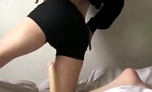 Shemale babe fucking her big ass on a big dildo