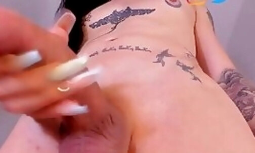 Tattooed tranny girl masturbates her beautiful cock