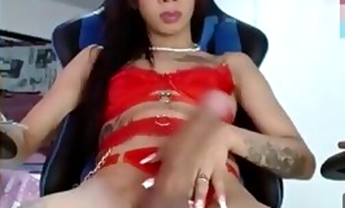slim teen trans cutie with tattoos strokes her huge dick on webcam