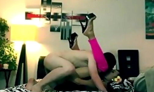 Black tranny in pink spreads legs for a white lad