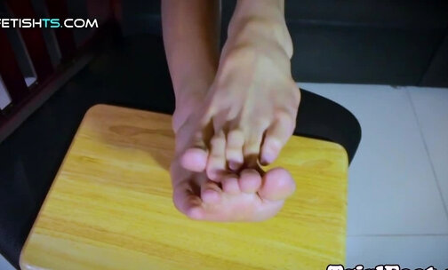 Toes curling ladyboy rubbing her feet