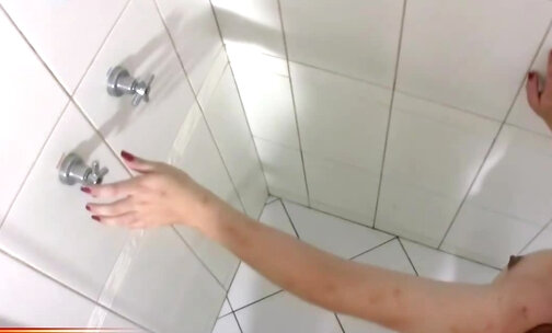 Chubby teen shemale is stroking decent sized dick in shower