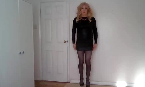 Black leather minidress and pantyhose