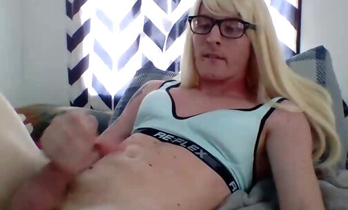 Skinny blonde crossdresser cums on his flat belling wearing only a sports bra