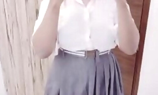 Sissy in school uniform modeling her outfit