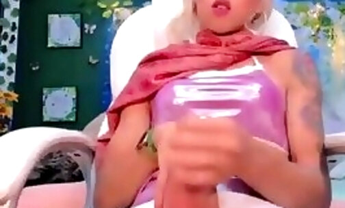 slim transgirl with tattoos jetks off her big massive cock on cam