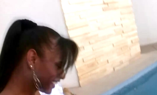 Ebony tranny takes a dip in the pool and masturbates