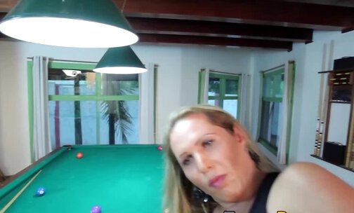 Busty shemale in high heels plays on 8 ball pool table