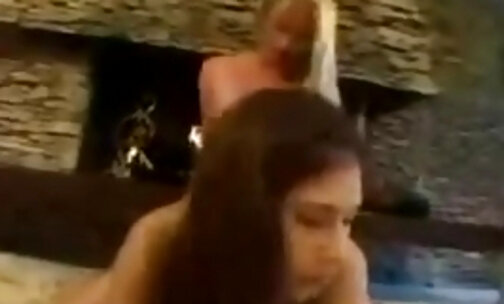 TS and girl 69 pose petting and fucking by the fireplace