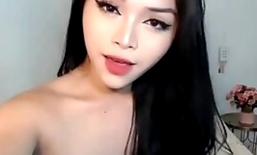 petite asian shemale with small boobs strokes her small dick on webcam