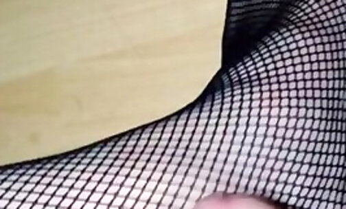 Sissy in black fishnets masturbating and cumming on her foot